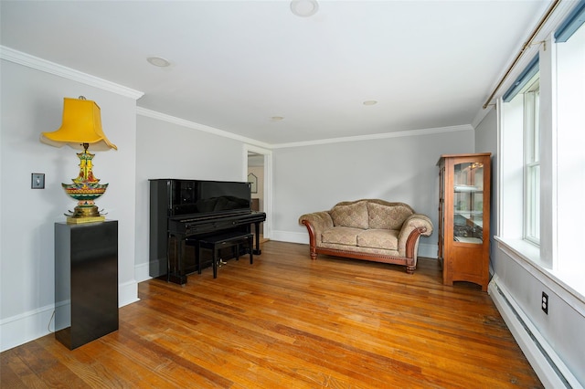 591 Hillside Lake Rd, Wappingers Falls, NY 12590 - sitting room featuring baseboard heating, light wood-style floors, and ornamental molding