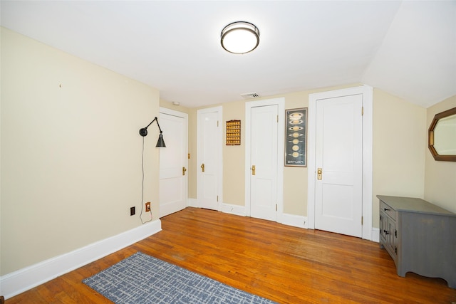 591 Hillside Lake Rd, Wappingers Falls, NY 12590 - unfurnished bedroom with wood finished floors and baseboards