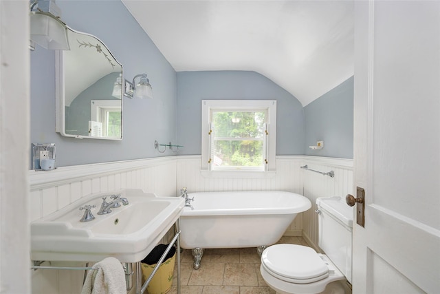 591 Hillside Lake Rd, Wappingers Falls, NY 12590 - full bath featuring vaulted ceiling, a soaking tub, and a wainscoted wall
