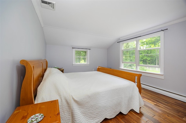 591 Hillside Lake Rd, Wappingers Falls, NY 12590 - bedroom featuring lofted ceiling, wood finished floors, and a baseboard radiator
