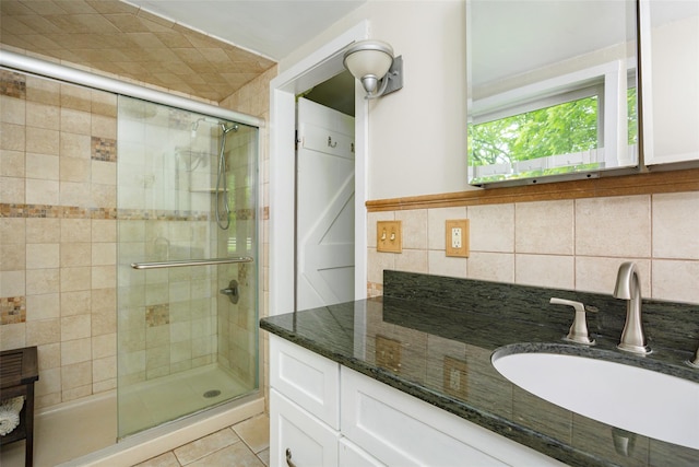 591 Hillside Lake Rd, Wappingers Falls, NY 12590 - bathroom with a stall shower, vanity, tile patterned floors, and tasteful backsplash
