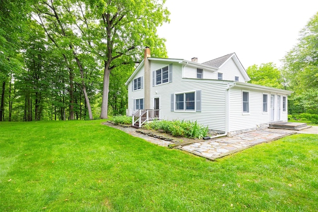 591 Hillside Lake Rd, Wappingers Falls, NY 12590 - back of house featuring a chimney and a yard