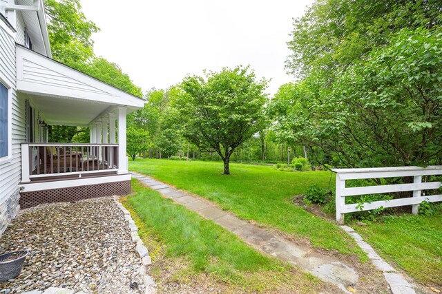 591 Hillside Lake Rd, Wappingers Falls, NY 12590 - view of yard with a porch and view of wooded area