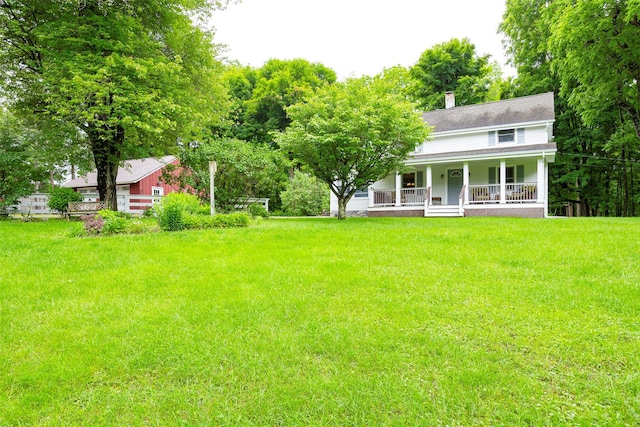 591 Hillside Lake Rd, Wappingers Falls, NY 12590 - view of green lawn with covered porch