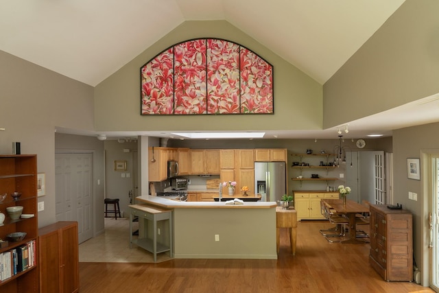 70 Reardon York Est, Canaan, NY 12029 - kitchen featuring appliances with stainless steel finishes, high vaulted ceiling, light wood-style floors, open shelves, and a peninsula