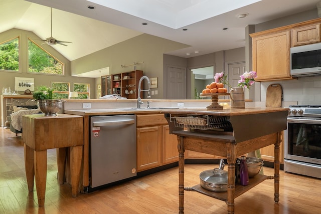 70 Reardon York Est, Canaan, NY 12029 - kitchen featuring appliances with stainless steel finishes, light wood-style floors, healthy amount of natural light, vaulted ceiling, and recessed lighting