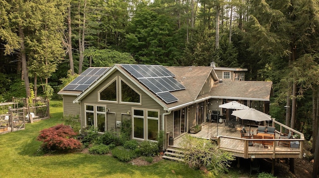70 Reardon York Est, Canaan, NY 12029 - rear view of house featuring a yard, outdoor dining space, a forest view, and solar panels