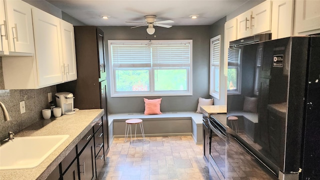 663 N Dunton Ave, East Patchogue, NY 11772 - kitchen with freestanding refrigerator, ceiling fan, white cabinetry, decorative backsplash, and recessed lighting