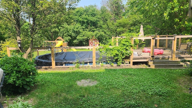 663 N Dunton Ave, East Patchogue, NY 11772 - view of grassy yard with a wooden deck