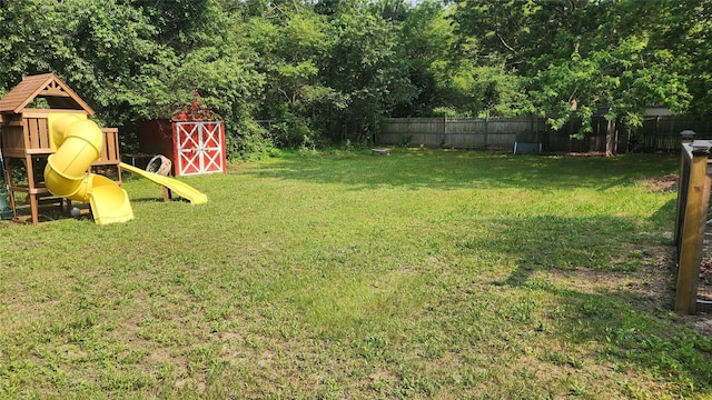 663 N Dunton Ave, East Patchogue, NY 11772 - view of yard featuring a playground and a storage shed