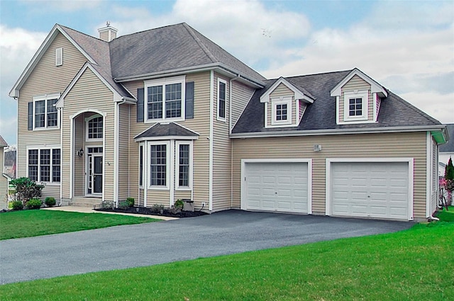 3 Moorefield Cir, Highland Mills, NY 10930 - traditional home with an attached garage, asphalt driveway, a front yard, and roof with shingles