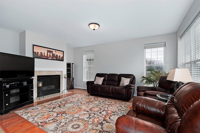 3 Moorefield Cir, Highland Mills, NY 10930 - living area with wood finished floors, plenty of natural light, and a glass covered fireplace