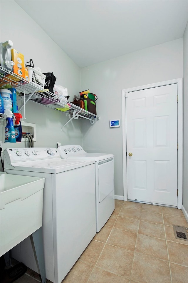3 Moorefield Cir, Highland Mills, NY 10930 - laundry area with washer and dryer and light tile patterned floors