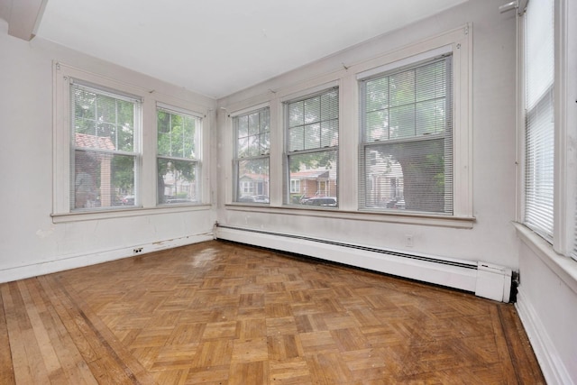 88-11 79th Ave, Glendale, NY 11385 - unfurnished sunroom with a baseboard radiator and baseboards
