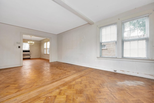 88-11 79th Ave, Glendale, NY 11385 - spare room featuring a chandelier and baseboards