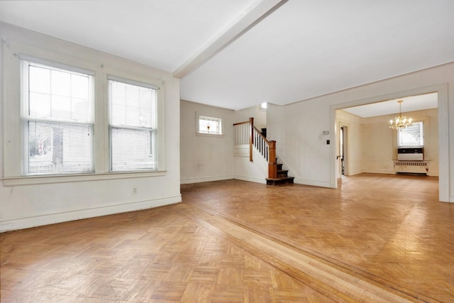 88-11 79th Ave, Glendale, NY 11385 - unfurnished living room with a chandelier, stairs, and radiator heating unit