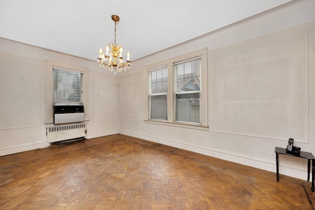 88-11 79th Ave, Glendale, NY 11385 - spare room with radiator and a chandelier
