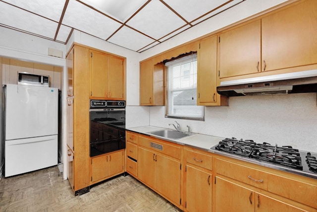 88-11 79th Ave, Glendale, NY 11385 - kitchen with black appliances, a warming drawer, under cabinet range hood, backsplash, and light countertops