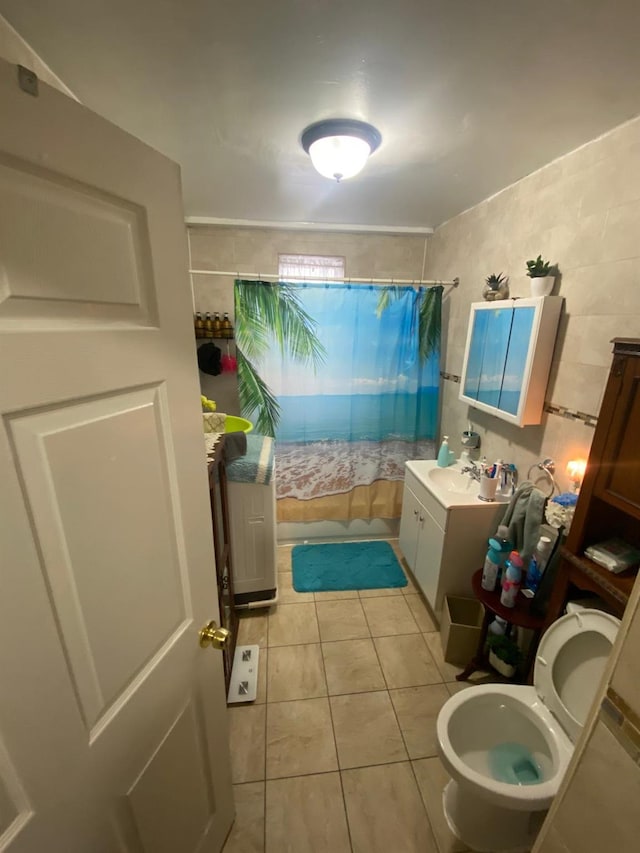 1459 Rosedale Ave, Bronx, NY 10460 - full bathroom with tile patterned floors, a shower with shower curtain, vanity, and tile walls