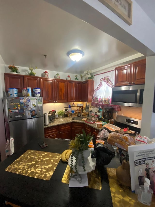1459 Rosedale Ave, Bronx, NY 10460 - kitchen featuring appliances with stainless steel finishes and reddish brown cabinets
