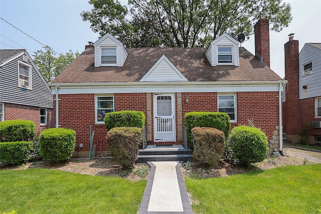 33 Cherry Ln, Carle Place, NY 11514 - cape cod home with brick siding, a front lawn, and a chimney