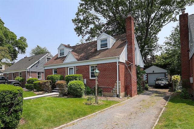 33 Cherry Ln, Carle Place, NY 11514 - cape cod-style house featuring brick siding, an outdoor structure, a front yard, a detached garage, and a chimney