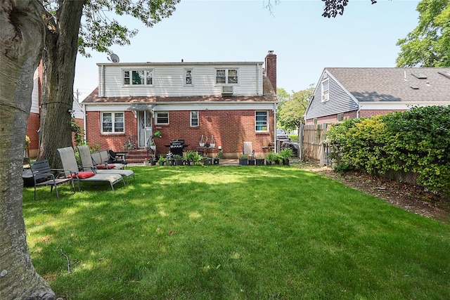 33 Cherry Ln, Carle Place, NY 11514 - rear view of property featuring brick siding, entry steps, and a chimney