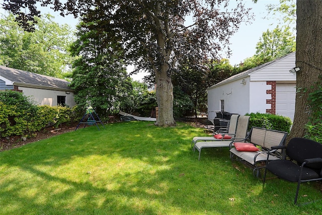 33 Cherry Ln, Carle Place, NY 11514 - view of grassy yard featuring a garage