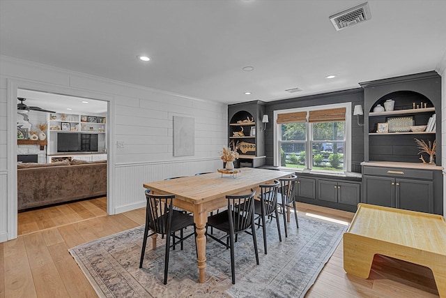 135 Vanderbilt Blvd, Oakdale, NY 11769 - dining space with ornamental molding, light wood-style floors, and recessed lighting