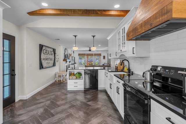 135 Vanderbilt Blvd, Oakdale, NY 11769 - kitchen featuring black appliances, premium range hood, dark countertops, a peninsula, and decorative backsplash