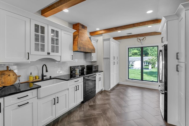 135 Vanderbilt Blvd, Oakdale, NY 11769 - kitchen with black appliances, custom exhaust hood, beam ceiling, white cabinets, and recessed lighting