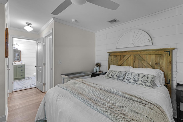 135 Vanderbilt Blvd, Oakdale, NY 11769 - bedroom featuring ornamental molding, wood walls, wood finished floors, and a ceiling fan