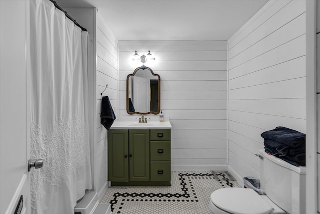 135 Vanderbilt Blvd, Oakdale, NY 11769 - full bathroom featuring vanity, tile patterned flooring, wood walls, and curtained shower