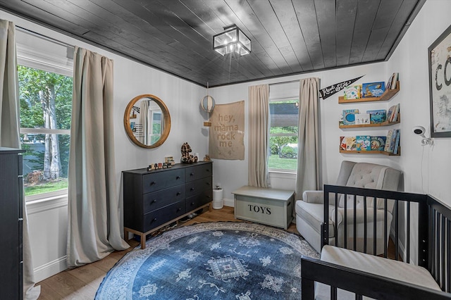 135 Vanderbilt Blvd, Oakdale, NY 11769 - bedroom with multiple windows, wood finished floors, and wood ceiling