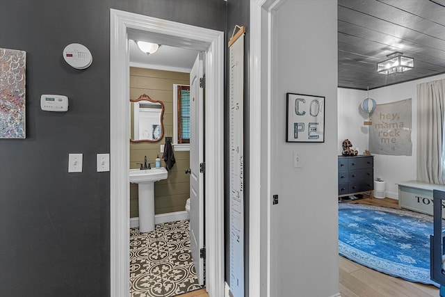 135 Vanderbilt Blvd, Oakdale, NY 11769 - hallway featuring ornamental molding and wood finished floors
