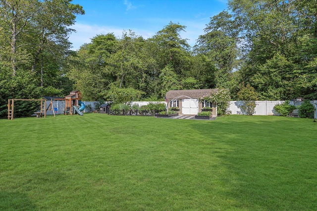 135 Vanderbilt Blvd, Oakdale, NY 11769 - fenced backyard with a storage unit and a playground