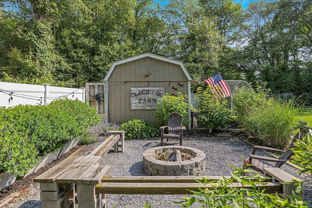 135 Vanderbilt Blvd, Oakdale, NY 11769 - view of patio with an outdoor fire pit and a storage shed