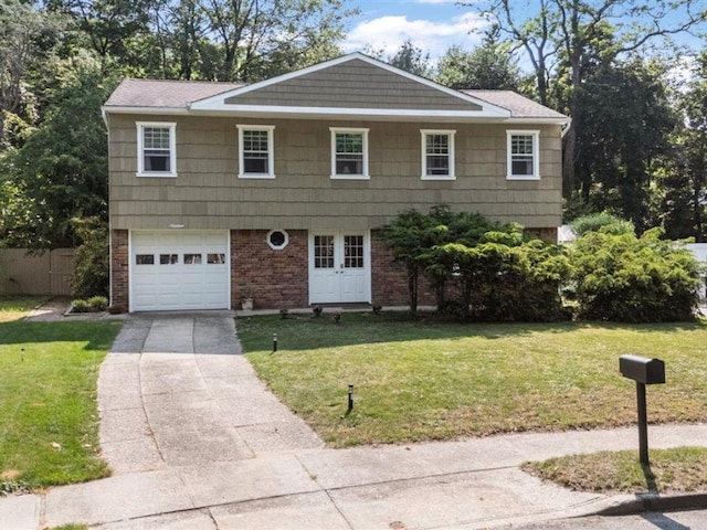 19 Salisbury Dr N, East Northport, NY 11731 - view of front of house featuring a garage, concrete driveway, and brick siding
