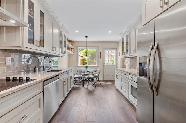 19 Salisbury Dr N, East Northport, NY 11731 - kitchen with appliances with stainless steel finishes, exhaust hood, backsplash, recessed lighting, and dark wood finished floors
