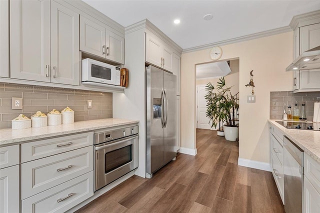 19 Salisbury Dr N, East Northport, NY 11731 - kitchen with stainless steel appliances, backsplash, dark wood-style flooring, light stone countertops, and recessed lighting