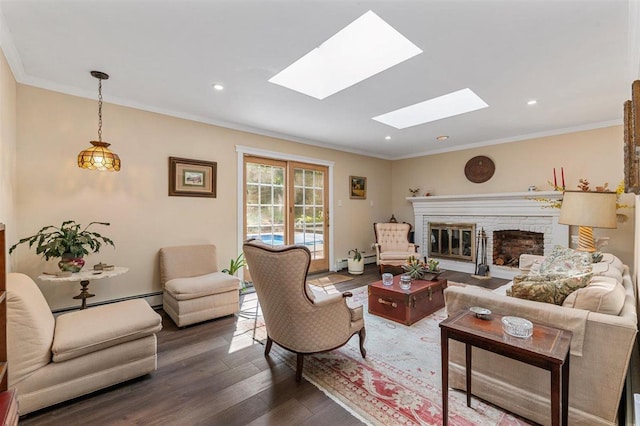 19 Salisbury Dr N, East Northport, NY 11731 - living area with a skylight, wood finished floors, a glass covered fireplace, ornamental molding, and baseboard heating