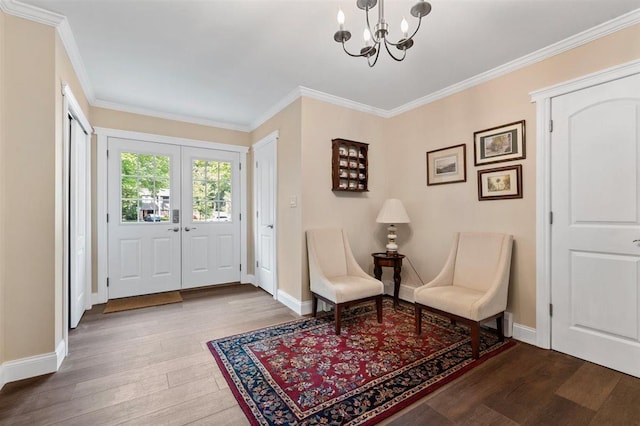 19 Salisbury Dr N, East Northport, NY 11731 - foyer with a chandelier, wood finished floors, and crown molding