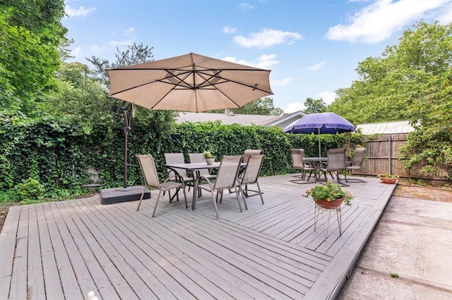 19 Salisbury Dr N, East Northport, NY 11731 - wooden deck featuring outdoor dining space and a fenced backyard