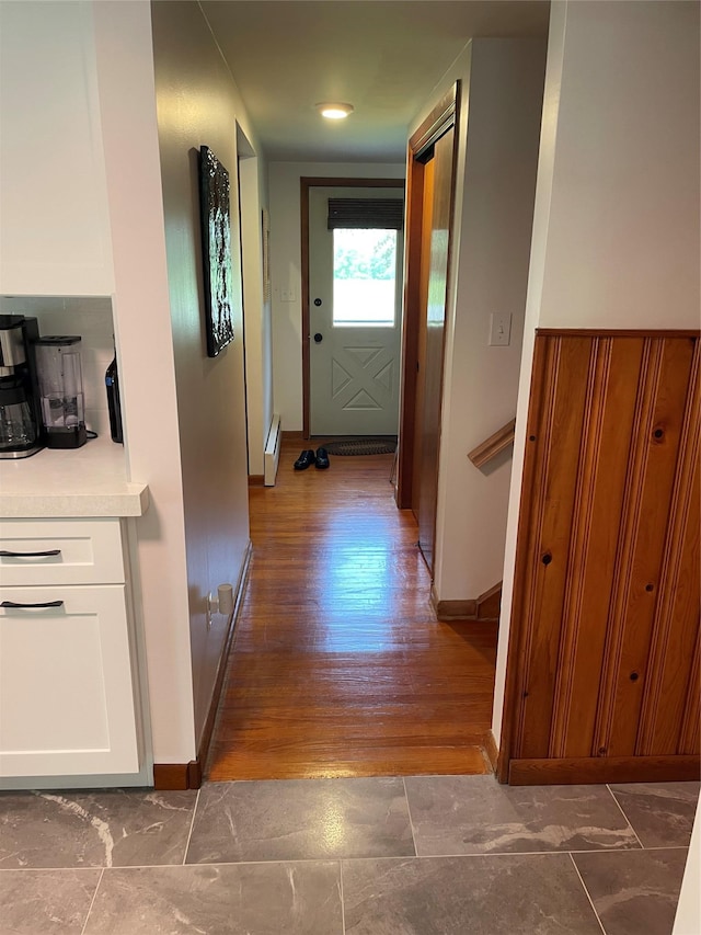 1289 State Route 208, Wallkill, NY 12589 - hallway with a baseboard heating unit and wood finished floors