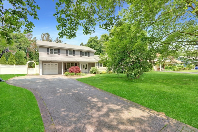 47 Lorijean Ln, East Northport, NY 11731 - view of front facade with asphalt driveway, an attached garage, and a porch
