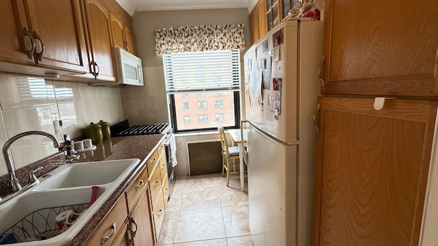 99-05 63rd Dr Unit 11Aa, Rego Park, NY 11374 - kitchen featuring white appliances, brown cabinetry, and dark countertops