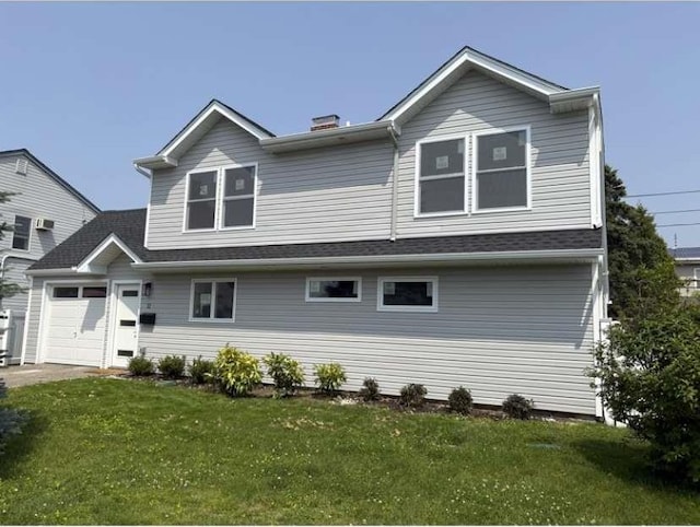 11 Wheelwright Ln, Levittown, NY 11756 - back of property featuring a garage, a lawn, and a chimney