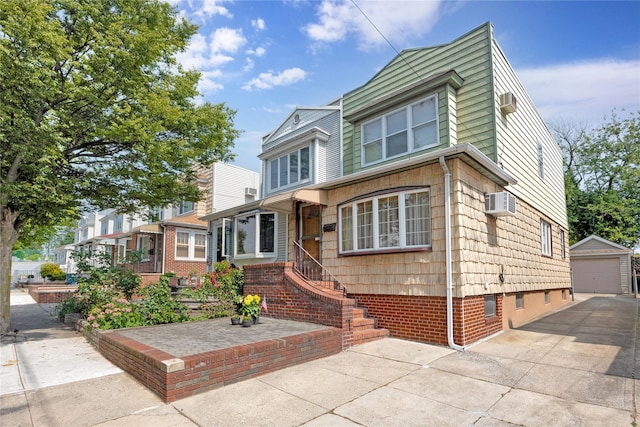 6438 60th Rd, Maspeth, NY 11378 - view of front of house featuring a garage and an outbuilding