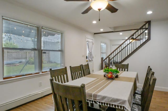 27 The Plains Rd, Levittown, NY 11756 - dining space featuring baseboard heating, wood finished floors, stairs, ceiling fan, and recessed lighting