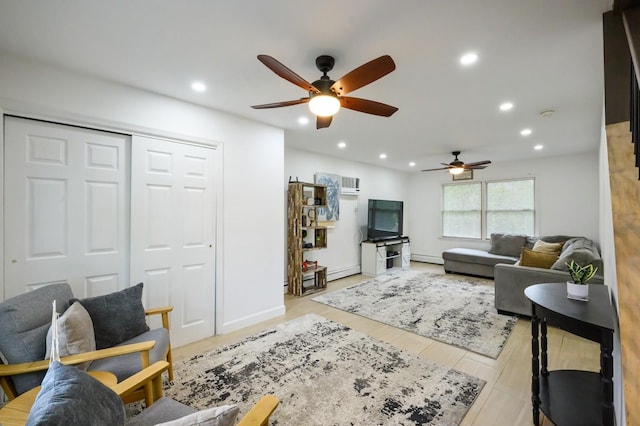 27 The Plains Rd, Levittown, NY 11756 - living area with ceiling fan, recessed lighting, baseboard heating, and light wood-style floors